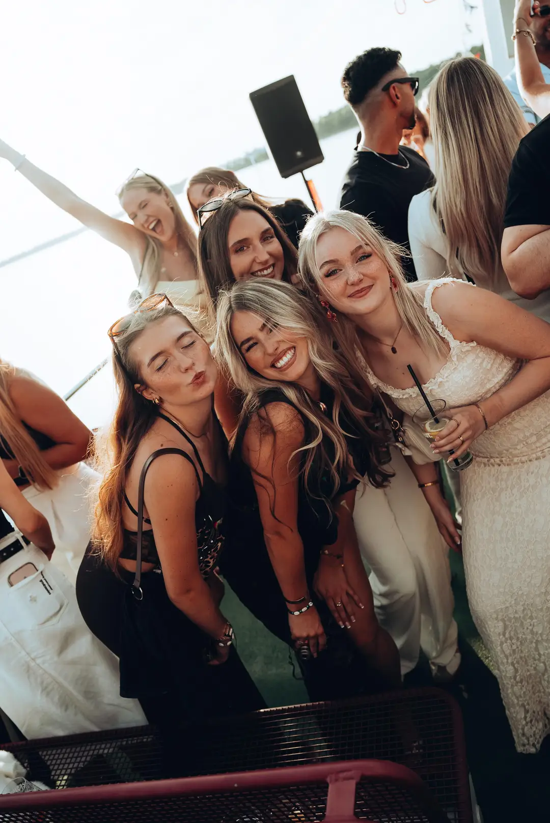Friends posing together on the dancefloor