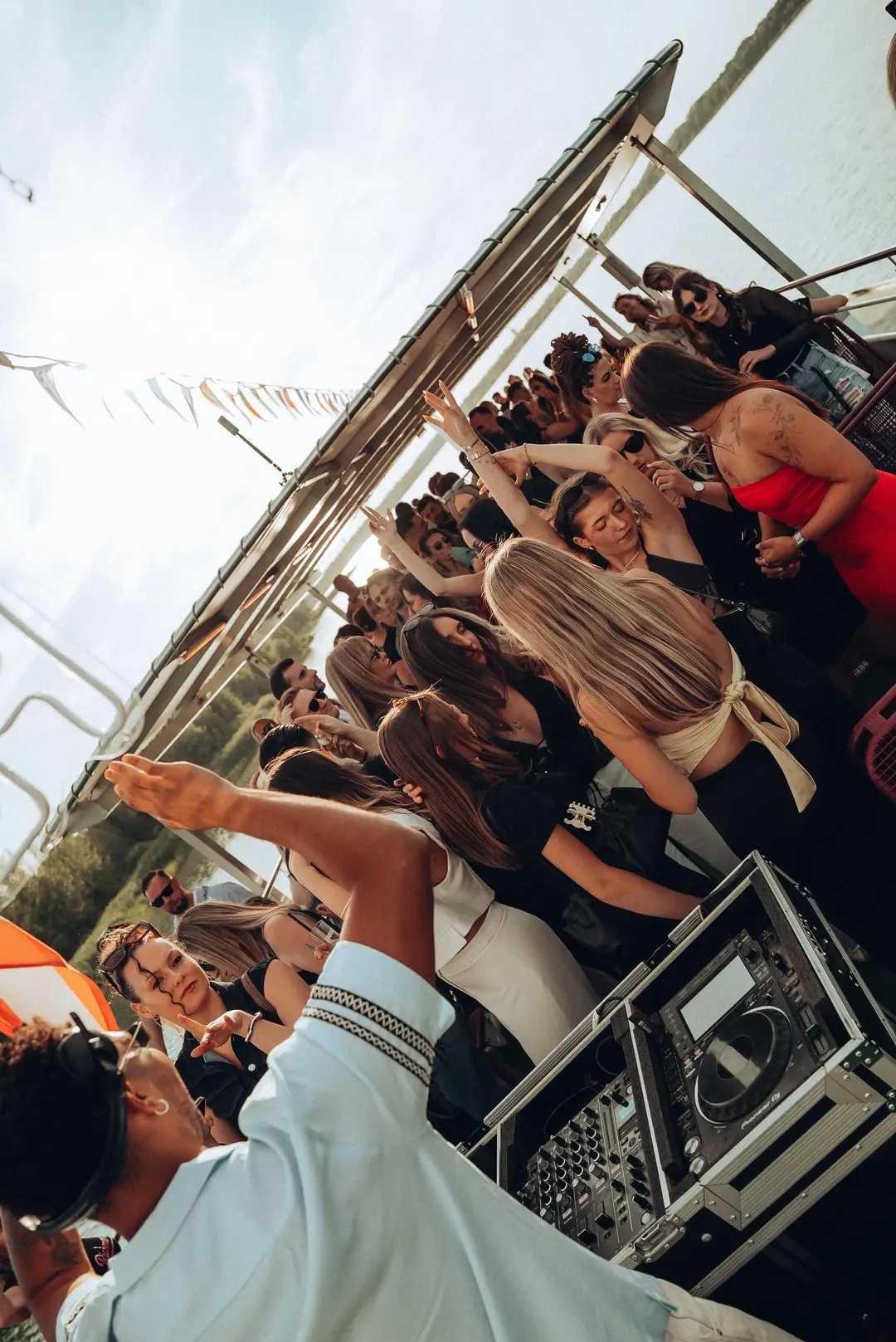 The crowd reaching towards the decks
