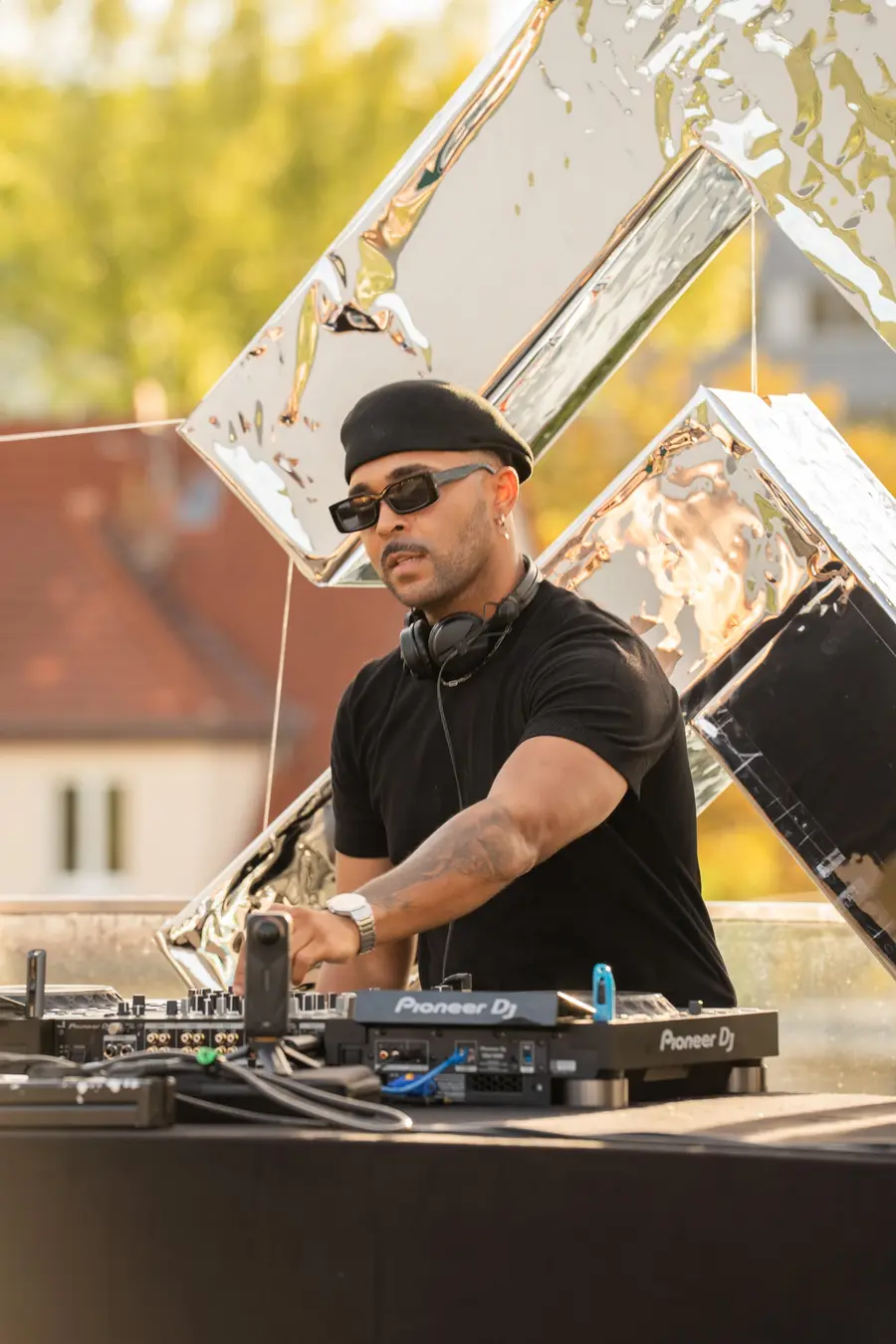SEKOU reaching across the decks at golden hour